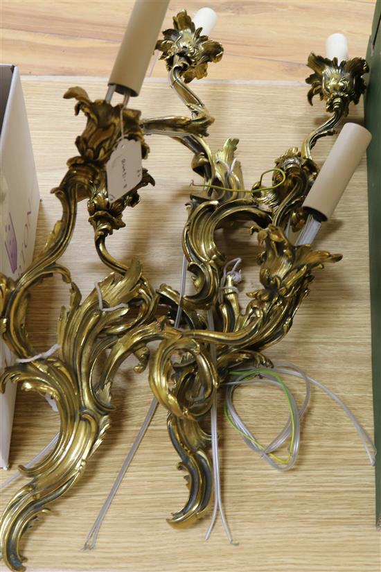 A set of three gilt brass twin branch wall lights, recently re-wired height 39cm